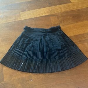 black pleated Ivivva tennis skort for girls